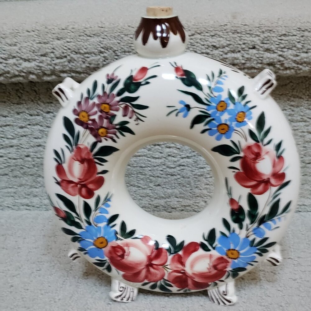 Vintage circular bottle with stopper